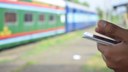 train-mobile-phone-hands-blurred.jpg