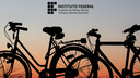 #pratodosverem: Imagem mostra duas bicicletas. Ao fundo aparece o horizonte. Acima está a logomarca do Campus Santos Dumont do IF Sudeste MG.